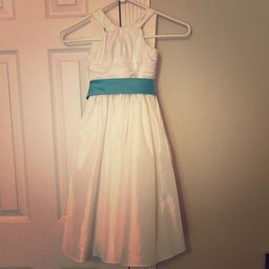 Girl’s ivory dress with belt